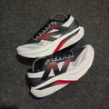 New Balance sc elite white black red