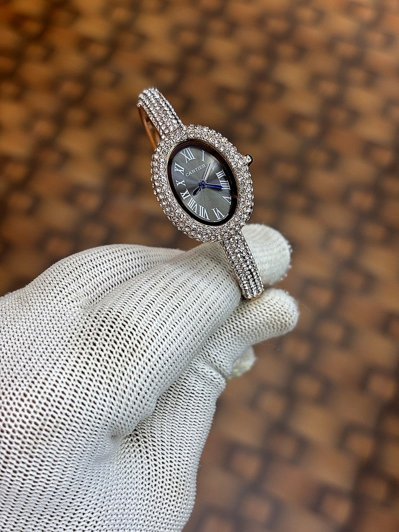 Cartier Baignoire watch in 18k rose gold with a diamond set bezel and bracelet