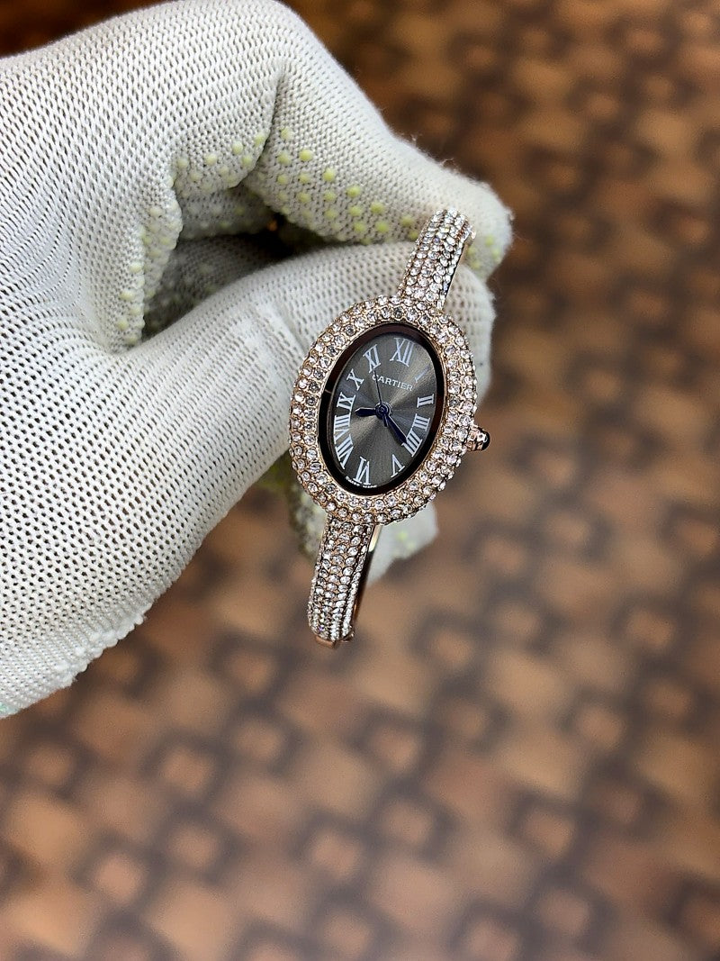 Cartier Baignoire watch in 18k rose gold with a diamond set bezel and bracelet